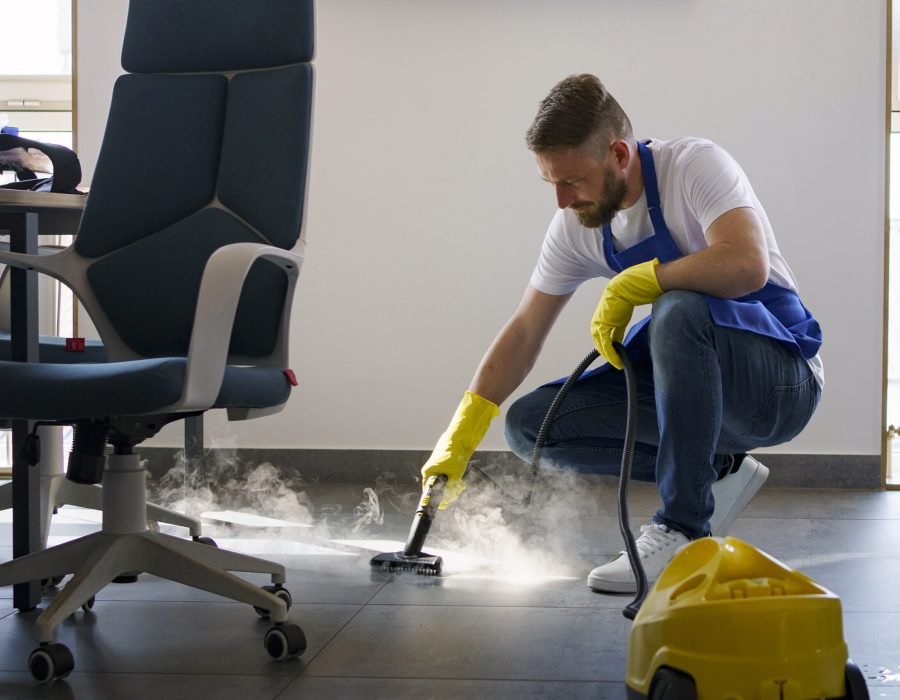 professional-cleaning-service-person-using-steam-cleaner-office